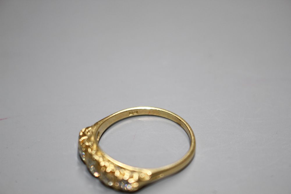 A modern 18ct gold and graduated five stone diamond half hoop ring,